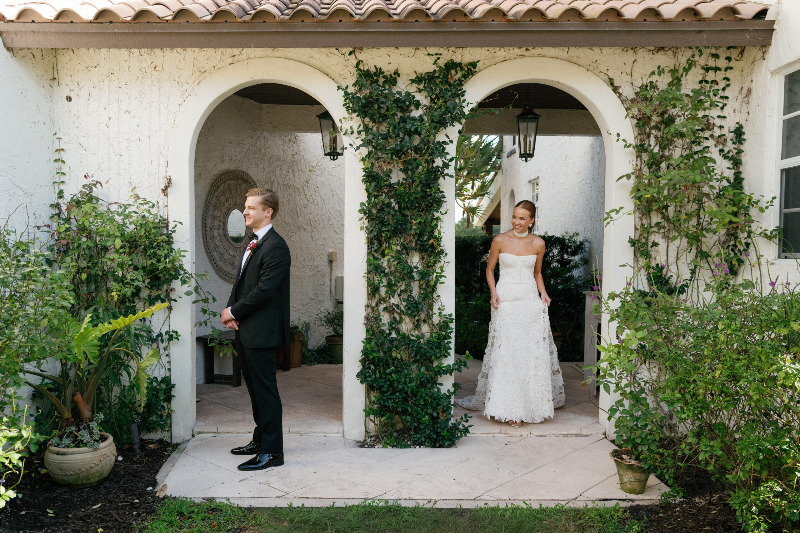 Newlyweds walking through a dramatic landscape at golden hour