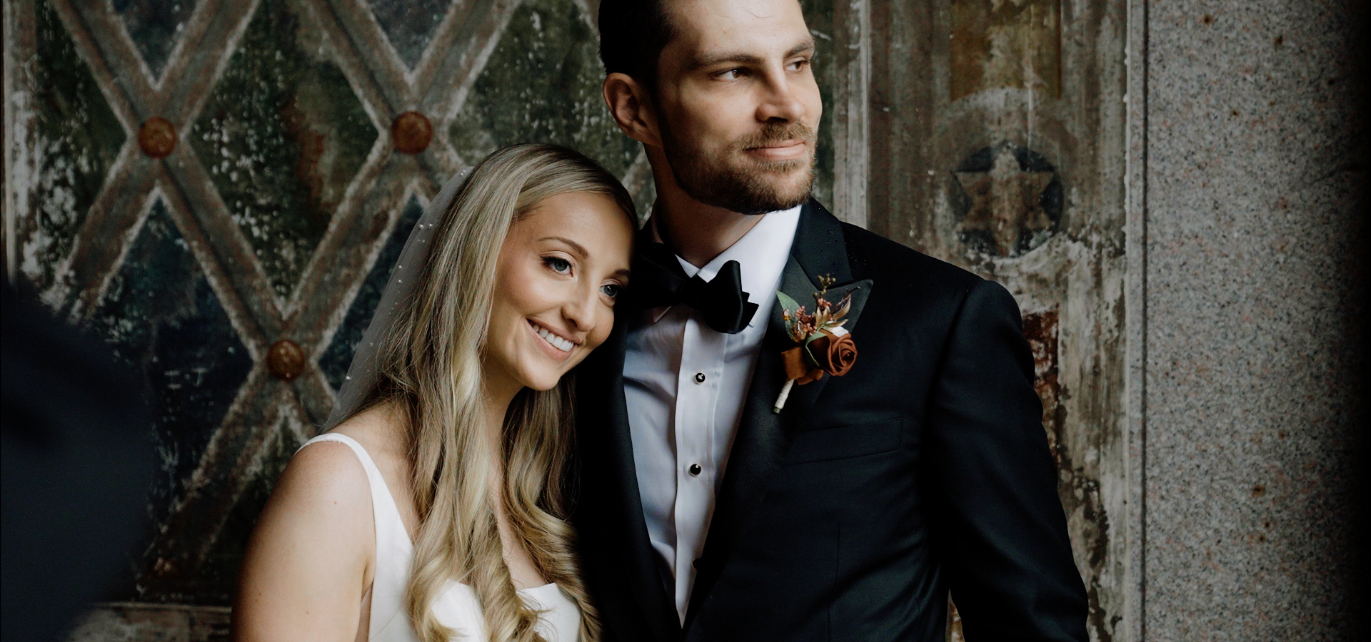 Newlyweds embracing at golden hour